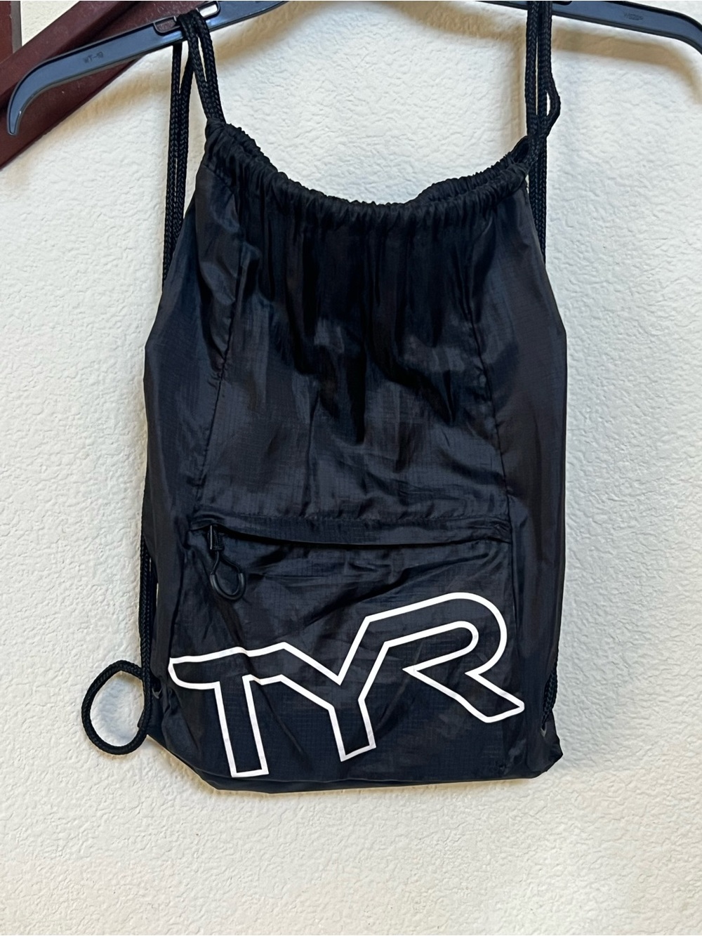 TYR Black Drawstring Backpack with White Logo and Front Zip